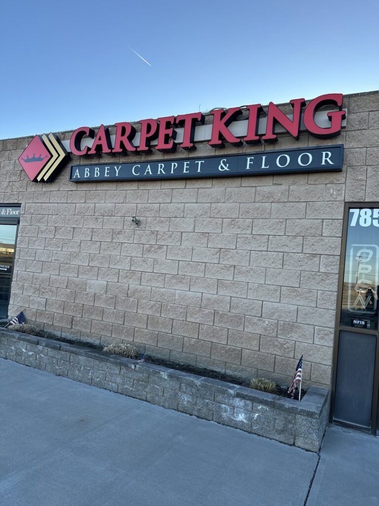 The storefront of Carpet King Interiors / Abbey Carpet & Floor in Fernley, NV, featuring the business sign.