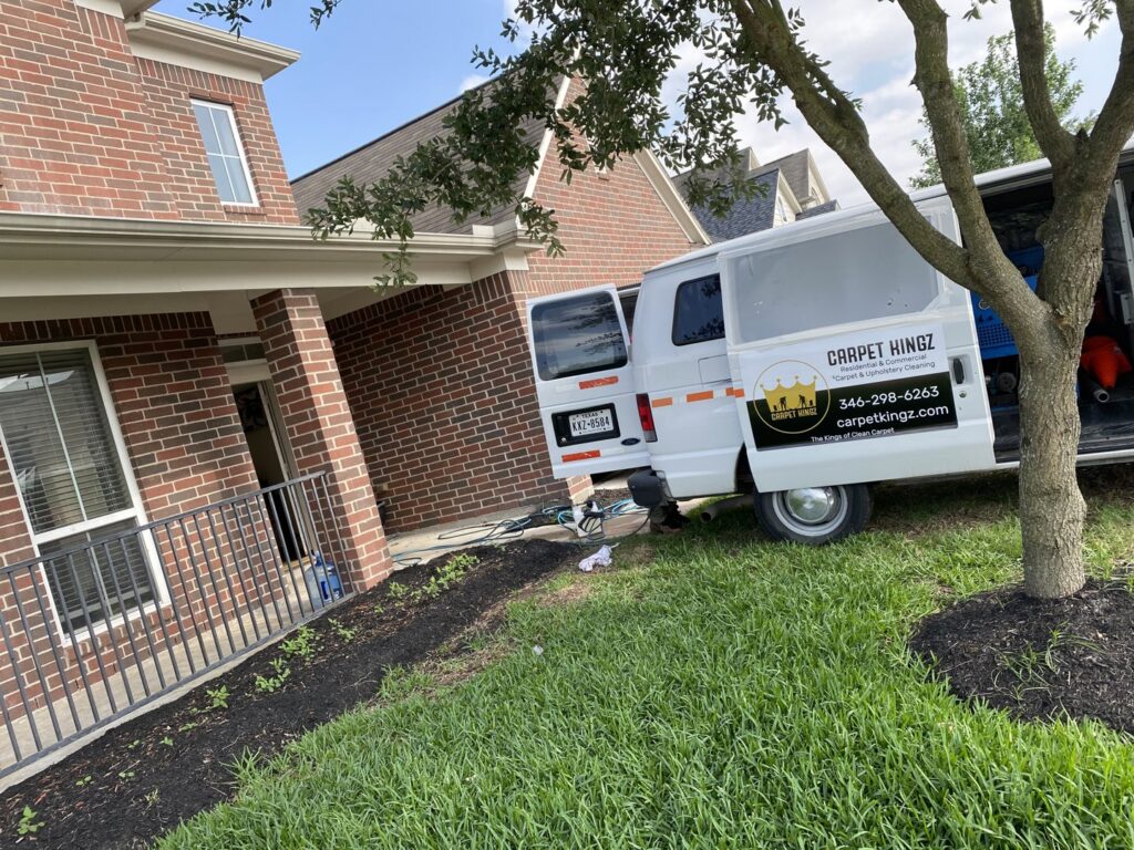 Carpet Kingz service van with cleaning equipment parked outside a home in Houston, TX
