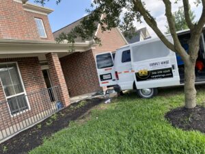 Carpet Kingz service van with cleaning equipment parked outside a home in Houston, TX
