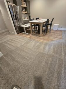 A room showcasing new carpet and LVT flooring installation by Big Red Flooring in Omaha, NE