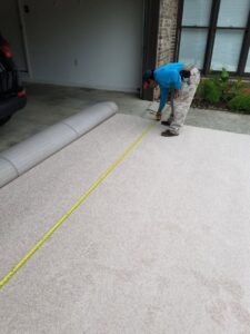 A professional measuring a roll of new carpet for installation by Right & Clean Atlanta 24-7 Carpet Cleaning in Atlanta, GA.