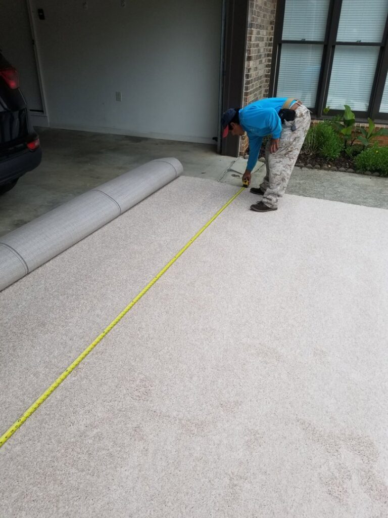 A professional measuring a roll of new carpet for installation by Right & Clean Atlanta 24-7 Carpet Cleaning in Atlanta, GA.