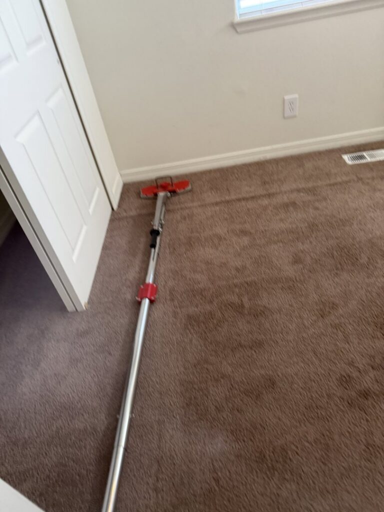 A carpet power stretcher tool used for carpet repair or installation by Believe That Carpets & Upholstery Cleaning in Colorado Springs, CO.