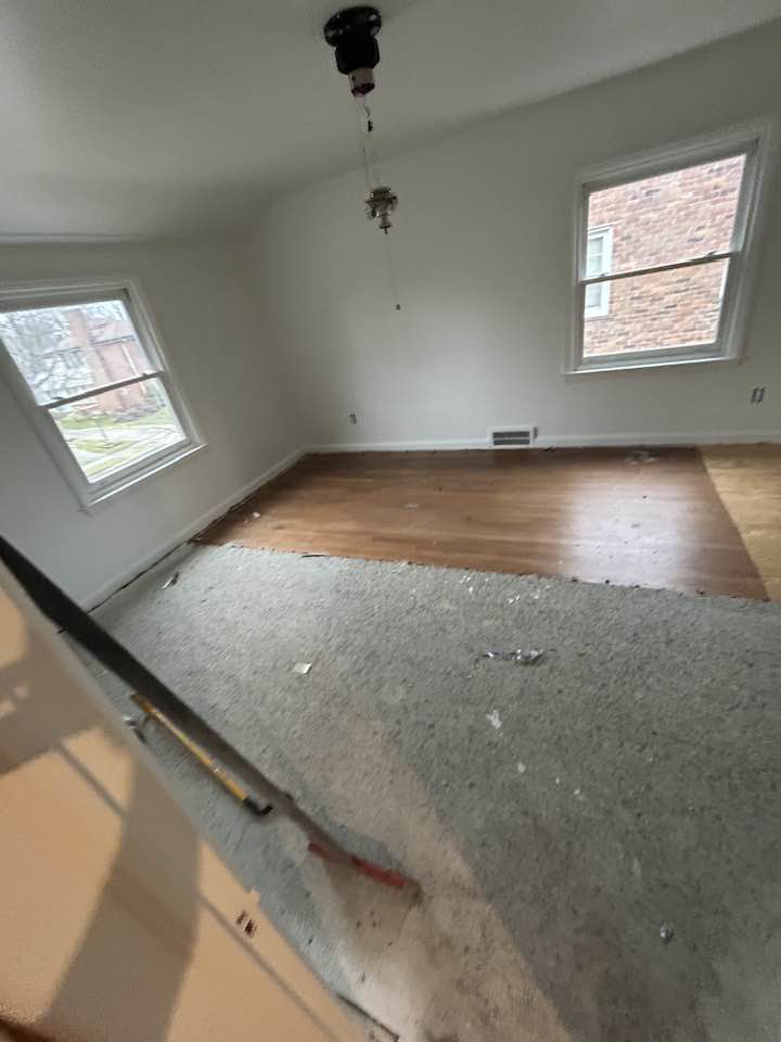 Carpet removal and new flooring installation in progress by Ron Ron's Hardwood Floors in Dearborn, MI.