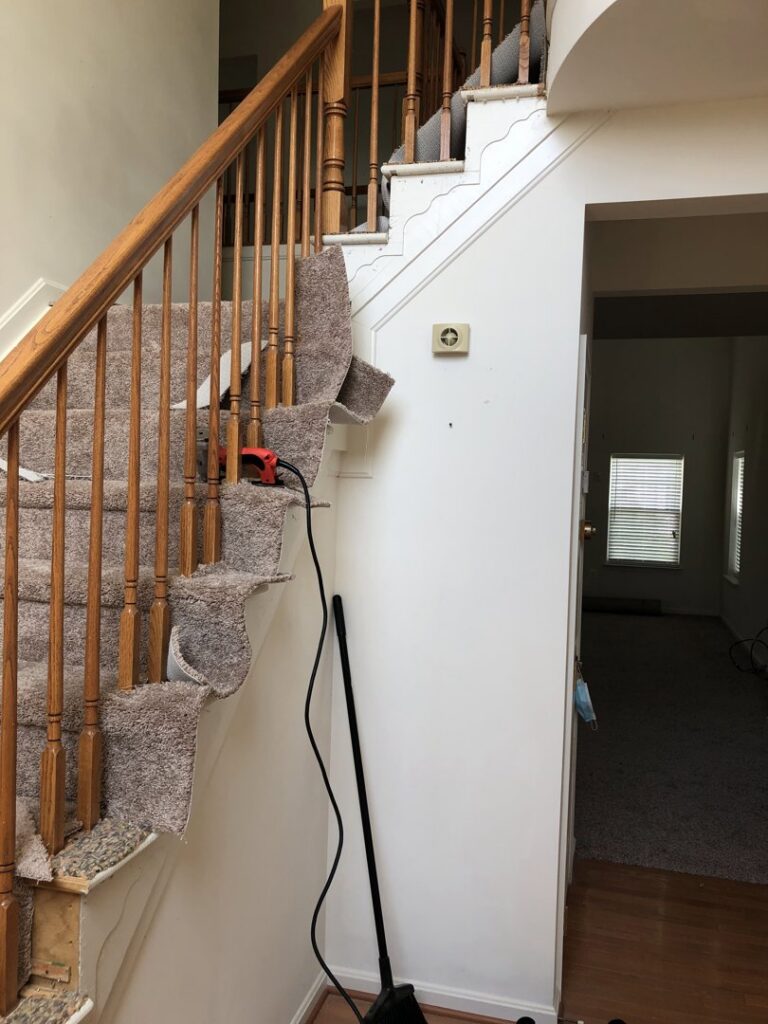 A staircase during carpet removal or installation, showing the process by S&H Floor Covering in Cross Junction, VA.