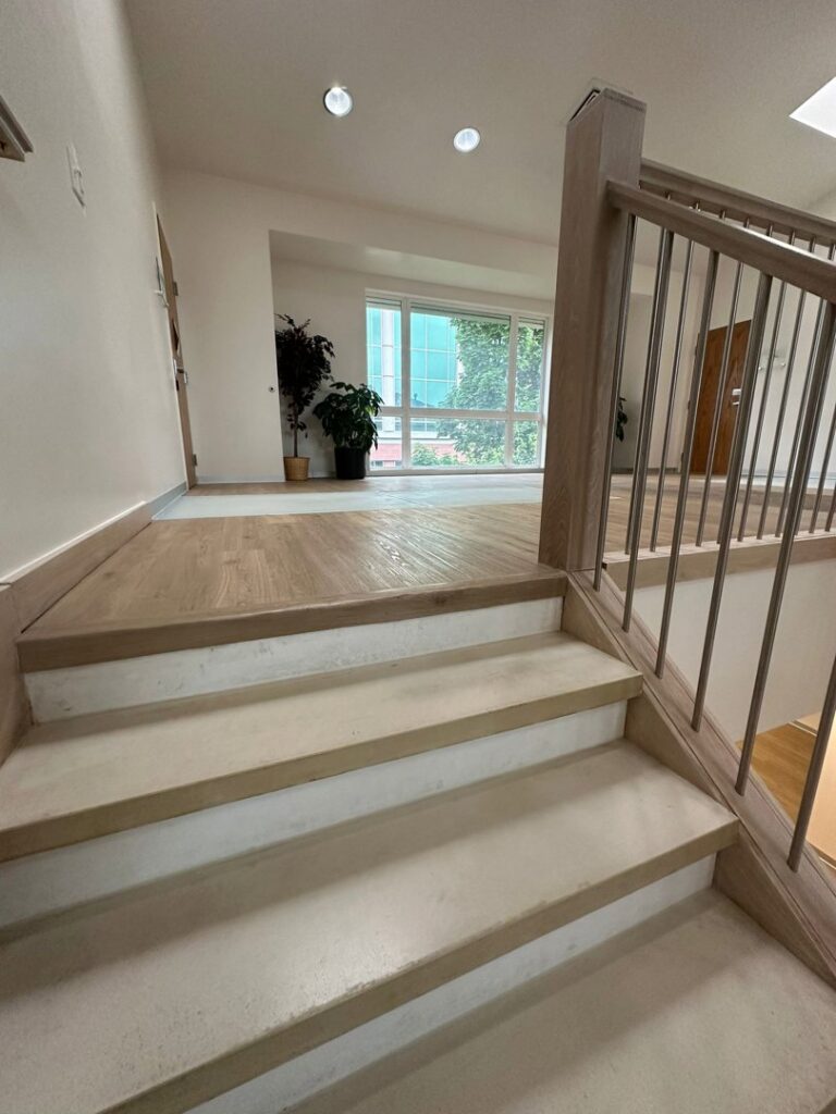 Stairs with carpet removed, showing subfloor, by Eige General Services in Orem, UT