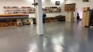 The spacious carpet repair and cleaning facility of Ziegler Preservation Cleaning in Danbury, CT, with supplies and equipment