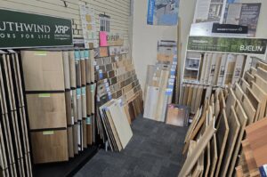 Large rolls of carpet and other flooring inventory stored in the warehouse of M&S Flooring Inc. in Ardmore, TN.
