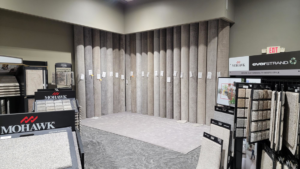 A showroom display of various carpet rolls and samples at CMH Interiors in Grand Island, NE