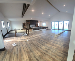 Rolls of new carpet ready for installation on a job site by Centennial Carpet & Flooring in Mitchell, SD.