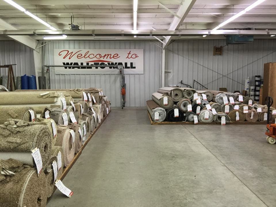 Large rolls of carpet stored in the warehouse of Wall To Wall Carpet One Floor & Home in Eau Claire, WI