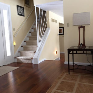 A professionally installed carpet runner on a residential staircase by Bloom FLOORist Inc. in Mount Joy, PA.