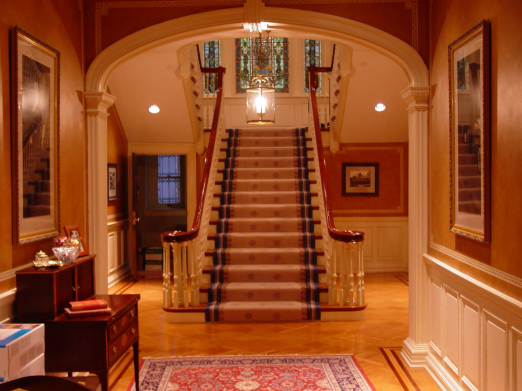 A beautifully installed carpet runner on a grand staircase by Nissly Professional Hardwood Flooring in Harrisburg, PA.