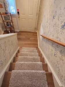 Stairs with a newly installed carpet runner by Jordan's Flooring in Martinsburg, WV