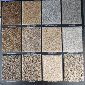 A carpet sample board displaying various colors and textures from New City Carpet And Flooring in Chicago, IL