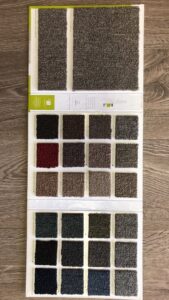 A Mainstreet carpet sample board showcasing various colors and textures from Carpets Texas in El Paso, TX.