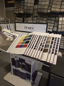 A showroom display of various carpet samples for selection at Big Red Flooring in Omaha, NE