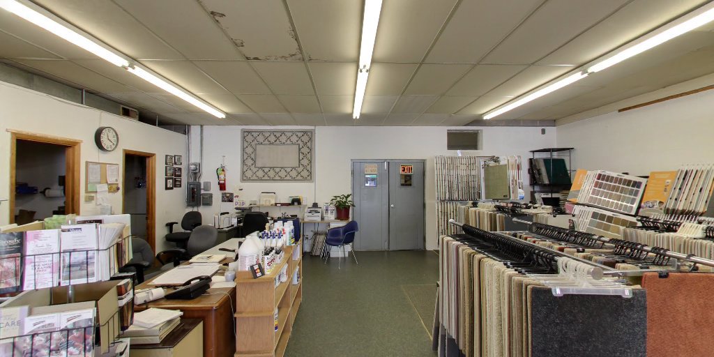 Carpet sample racks and an office area visible inside Eatherton's Fashion Floors showroom in St. Louis, MO.