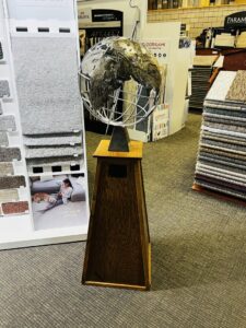 A detailed view of a carpet sample wall display in the Carpet World Fargo, ND showroom