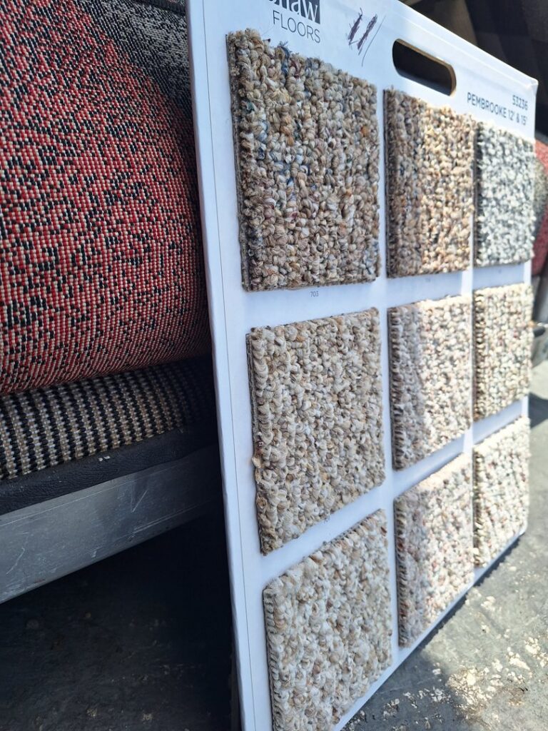 A display board with various carpet samples, showing options for clients at AFAB Carpets in Tampa, FL.