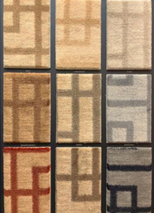 A display of various carpet samples showcasing patterns and textures at Adda Carpet and Flooring in New Orleans, LA.