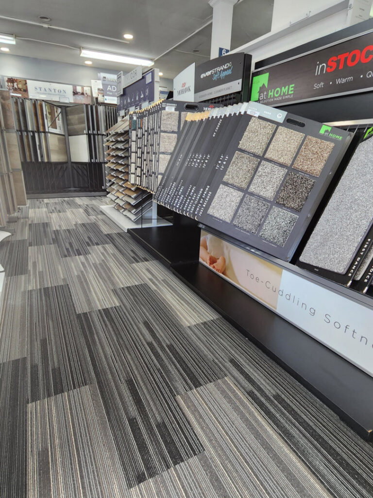 A showroom display featuring a wide selection of carpet samples and a carpeted floor at Jerry's Carpet Sales and Service in York, PA.
