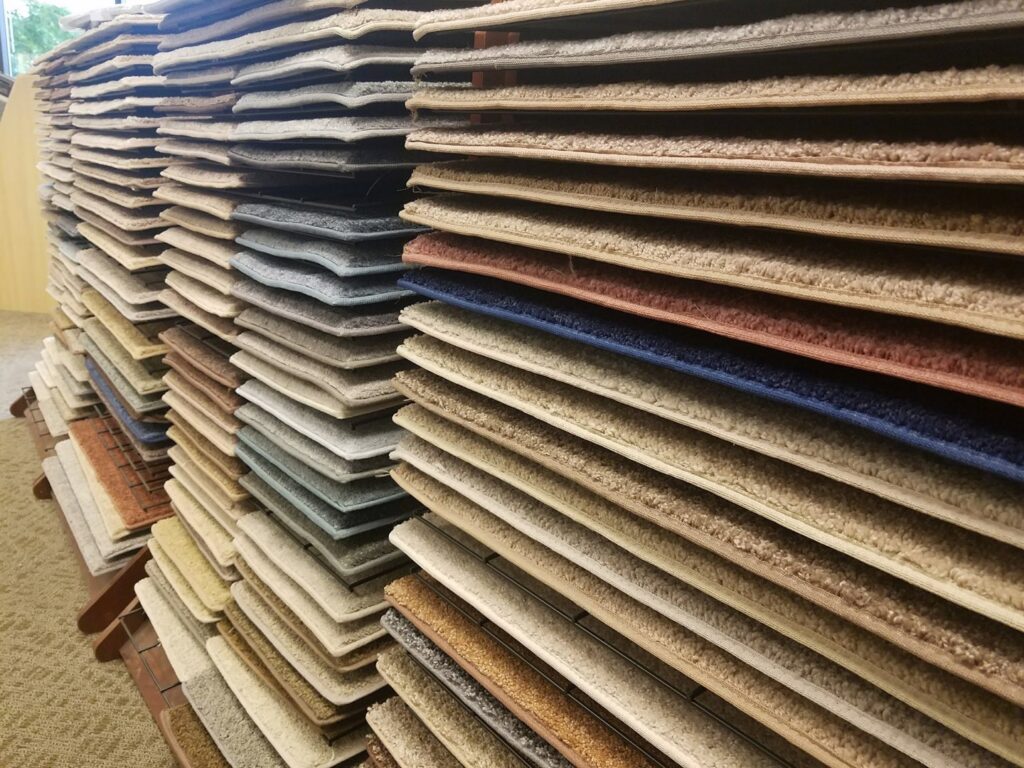 A wide selection of carpet samples displayed for customers at Ultimate Home Services in Indianapolis, IN.