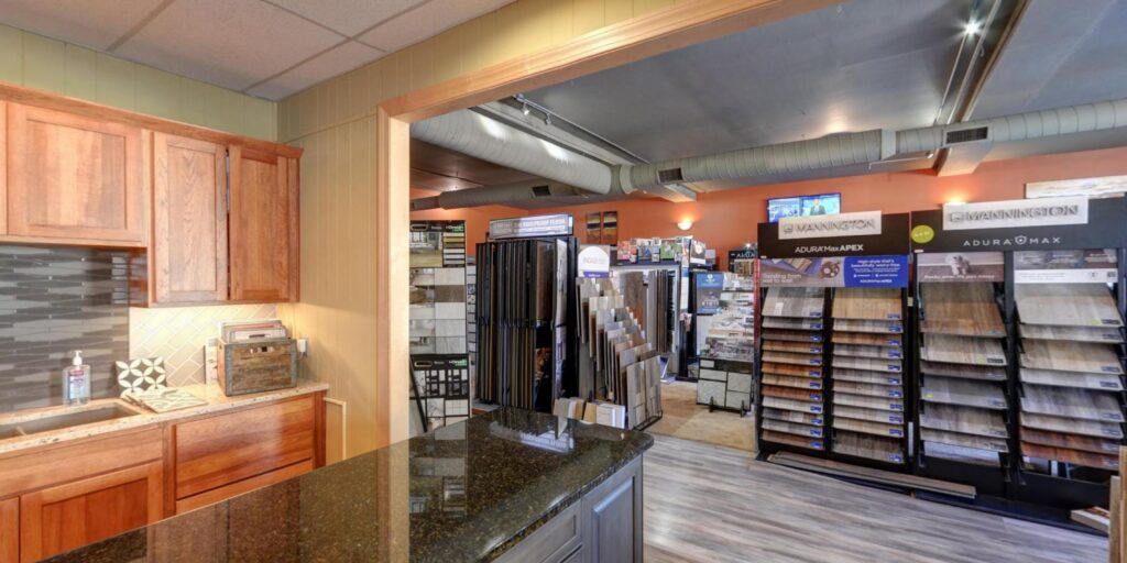 Carpet samples displayed on racks for selection at Home 360 Flooring Company in Columbus, NE.