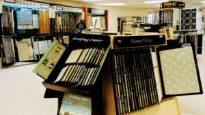 A wide selection of carpet samples displayed in the showroom at All Surfaces Wholesale in Houston, TX.