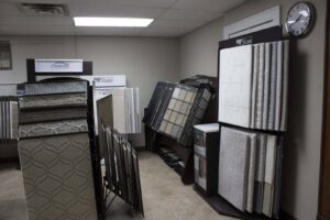 Various carpet samples displayed in the showroom of Infinite Floors Kitchens Bathrooms in Burnsville, MN