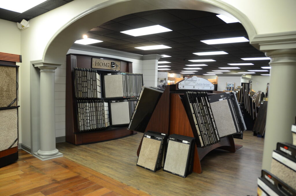 A wide selection of carpet samples displayed in the showroom at Madison Flooring & Paint in Madison, AL