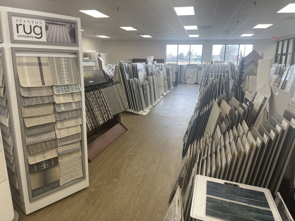 A wide selection of carpet samples displayed in the showroom at Spectrum Tile & Carpet, Inc. in Fall River, MA