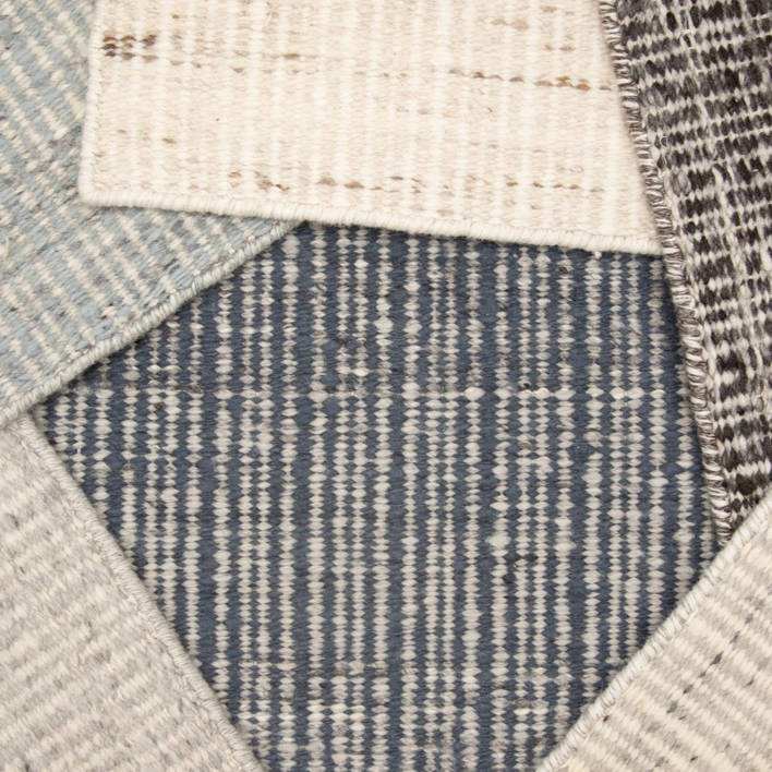 Close-up of various carpet samples with different patterns and textures at Carpet World Fargo, ND