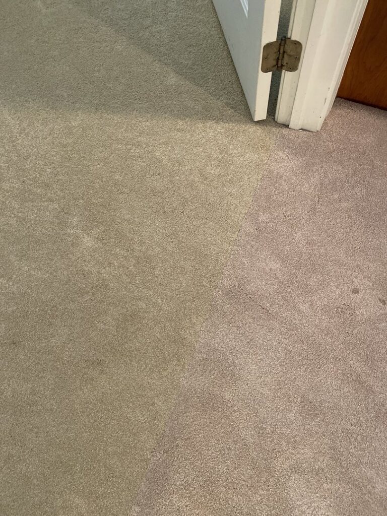 Close-up view of a neatly installed carpet seam and transition near a doorway by Carpets by EJ - Alemar in Wilmington, DE.