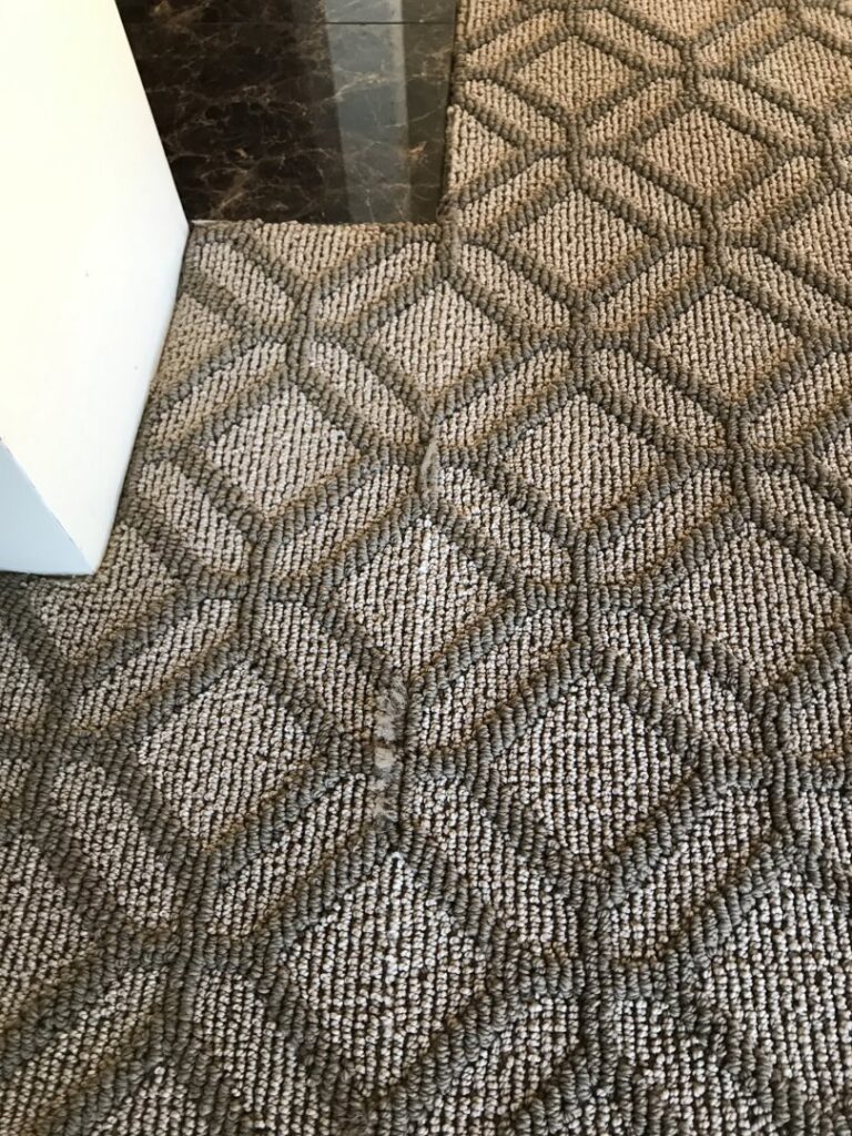 Close-up of a professionally installed carpet seam by MX Flooring in Vancouver, WA
