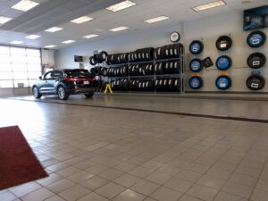 A carpet seam being repaired with a specialized tool by Ethan Fletcher, a carpet contractor in South Bend, IN.