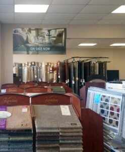 A wide selection of carpet rolls and samples displayed in the showroom at Carpets Plus Cabinets Plus in St. Louis, MO.