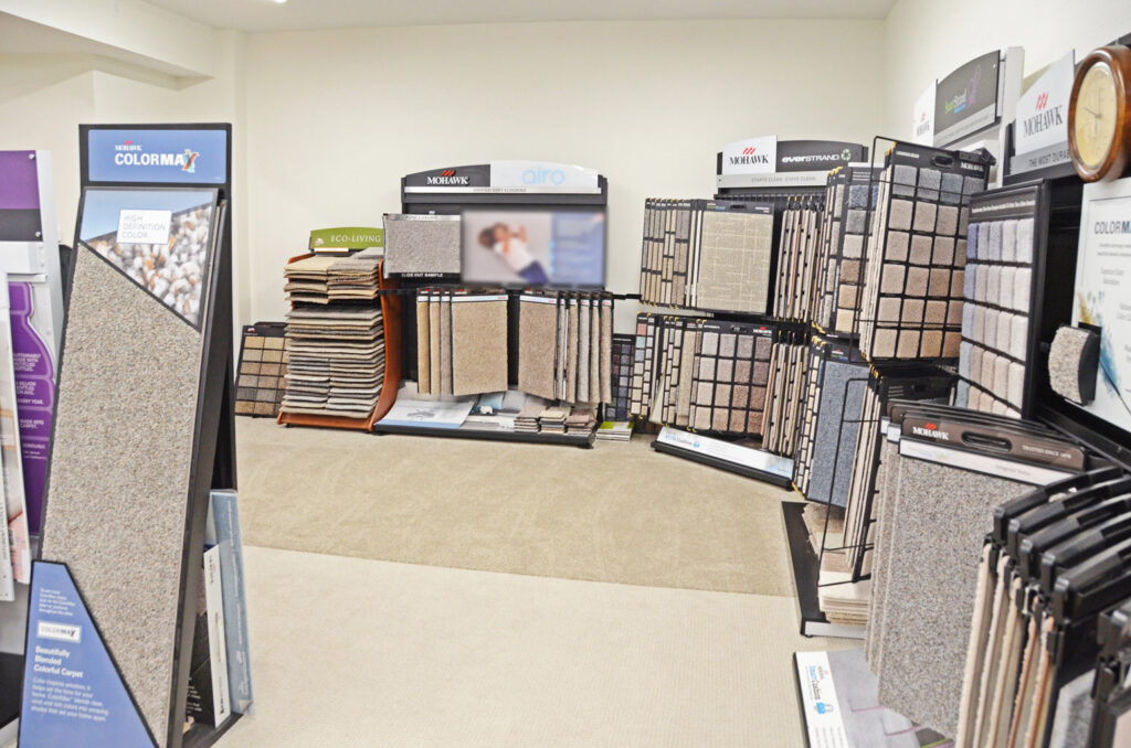 Extensive carpet showroom displays featuring various styles and colors at Luke Brothers Flooring in Ankeny, IA.