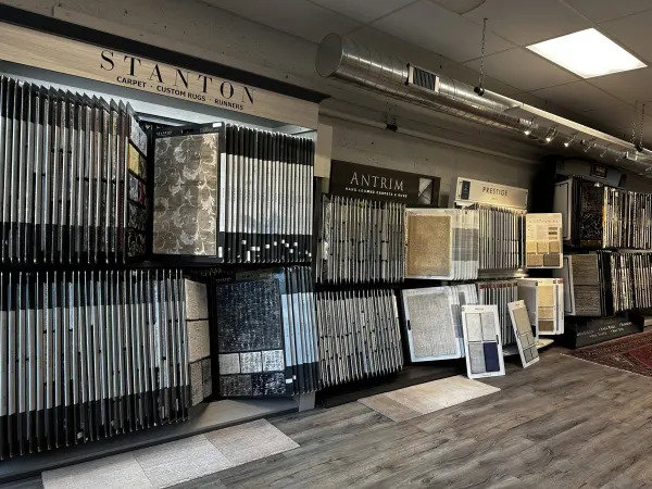 Interior view of the carpet showroom featuring Stanton and Antrim displays at Morency Flooring in New Bedford, MA.