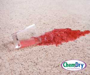 A red liquid spill on a carpet, demonstrating the need for stain removal service from Chem-Dry of Arlington & Alexandria in Alexandria, VA.