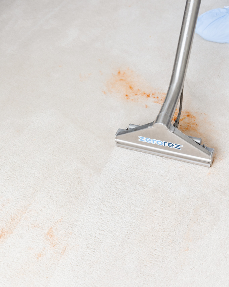 A Zerorez cleaning tool removing a tough stain from a carpet during a professional job in Naperville, IL, by Zerorez ChicagoLand.