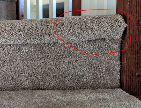 Close-up detail of a professional carpet stair installation by Family Carpet LLC in Wilmington, DE