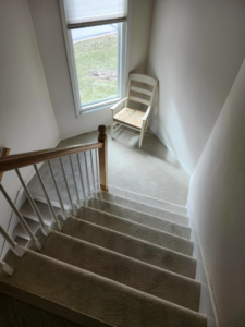 Clean, light-colored carpet installed on stairs and a landing by Zubeck Flooring in Blue Springs, MO