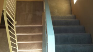 Carpeted stairs showing a clear line between cleaned and uncleaned sections by Integrity Cleaning Systems in Peoria, AZ
