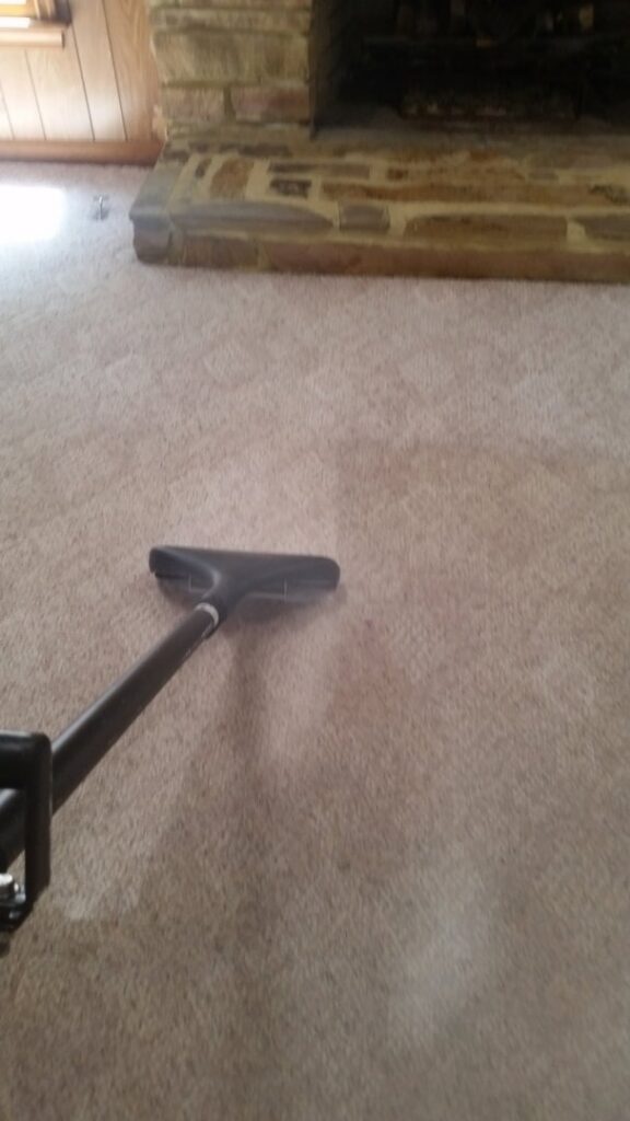 Carpet steam cleaning in progress with a professional wand by BareFoot Clean, Inc. in Virginia Beach, VA.