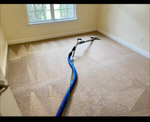 A carpet steam cleaning machine in operation, effectively cleaning a dirty carpet section by Ype Cleaning LLC in Monroe, NC.