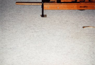 A carpet stretching tool on a light-colored carpet, indicating carpet repair or installation work by Heaven's Best Carpet Cleaning Idaho Falls ID.