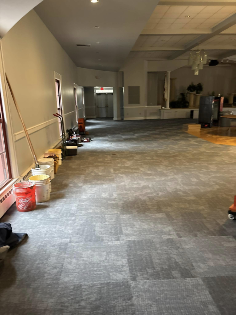 Carpet tile installation in progress in a commercial space by Branch Floor Covering in Cranston, RI