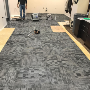 Carpet tile installation in progress at a commercial space by Metro Floor Covering Inc. in Livonia, MI
