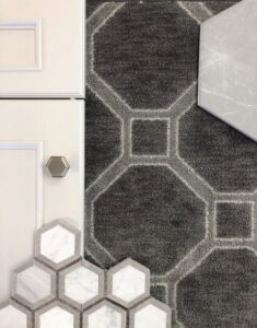Close-up of a carpet sample with tile and cabinet materials for design selection at Adda Carpet and Flooring in New Orleans, LA.